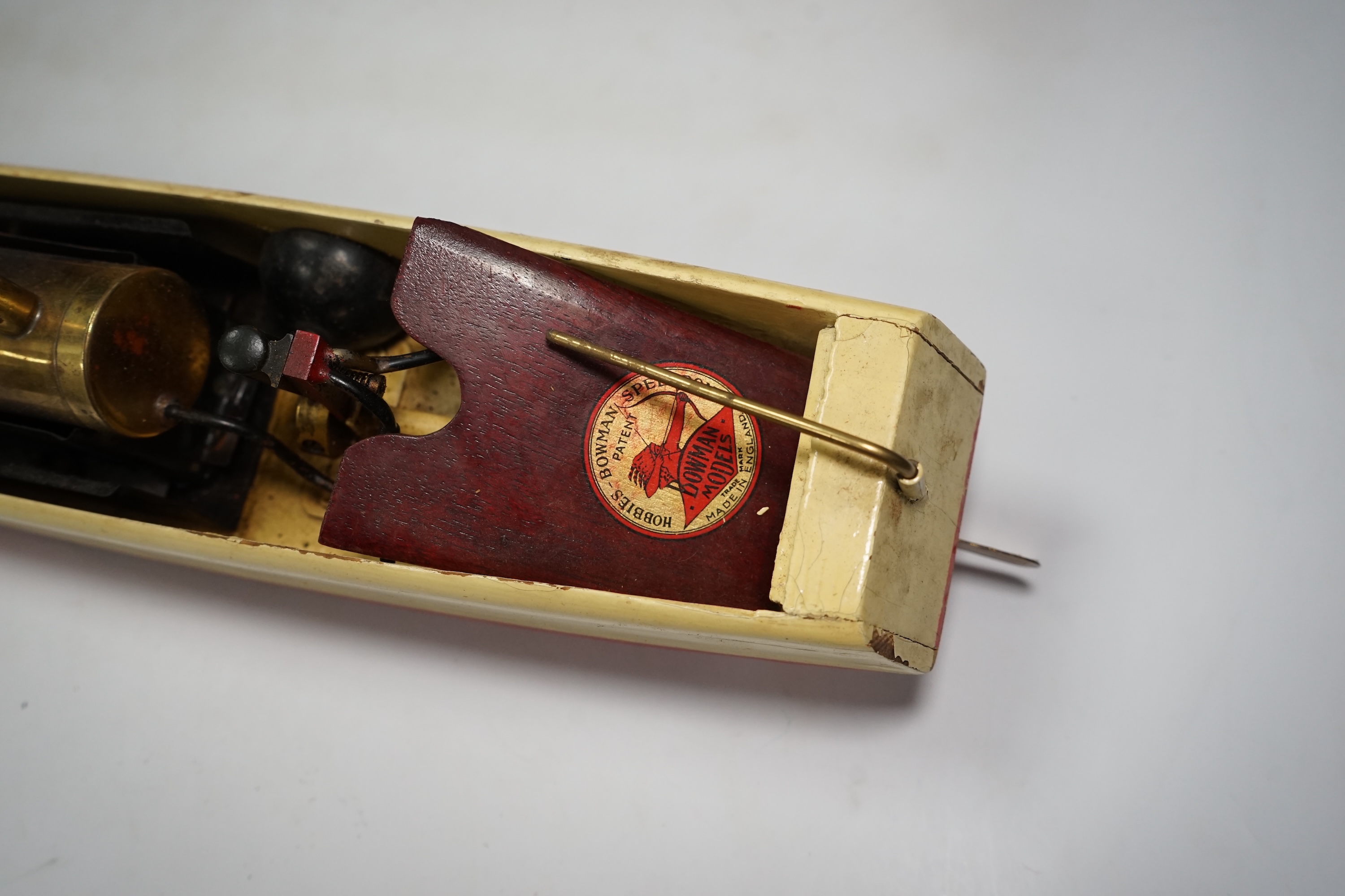 A 1930s wooden boxed Bowman Models live steam speedboat; ‘Swallow’, of wood and tinplate construction, hull 49cm long. Condition - fair.